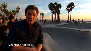 Errant skateboard hits reporter head on