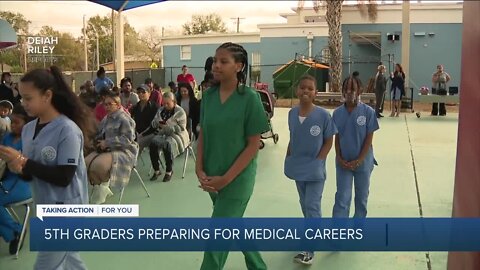 Dunbar Elementary 5th graders prepare for medical careers, receive ceremonial white coats