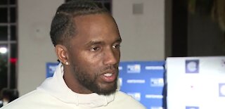 Raider's CB Casey Hayward helps distribute Thanksgiving meals to families in need