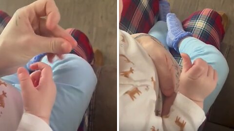 10-month-old baby girl adorably learns to snap her fingers