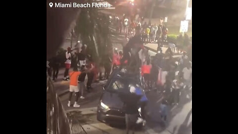 BREAKING: Reports of out control Spring Breakers jumping on occupied cars with fights breaking out