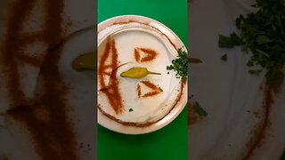 pumpkin design on hummus plate enjoy #shortsfeed #ohio #youtubeshorts #mediterraneanfood #hummus