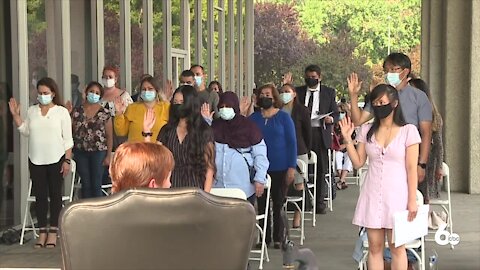 59 people become new U.S. citizens in three outdoor ceremonies