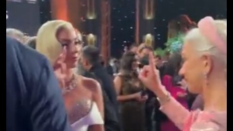 2023: Lady Gaga and Helen Mirren giving secret signs