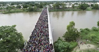 Breaking: 10s of thousands of illegals are streaming across the bridge in El Paso, Texas.