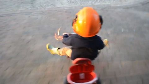 Cute Kid Rides Wind Powered Tricycle