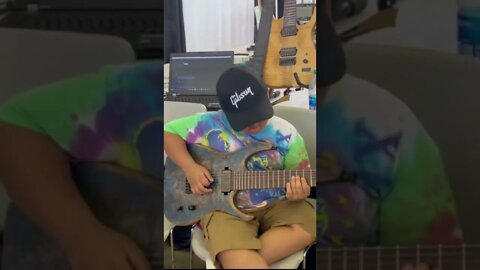 Jeck Rox (9-year-old guitarist ) trying out a 7-string Sacred Axes at Dallas Guitar Festival #shorts