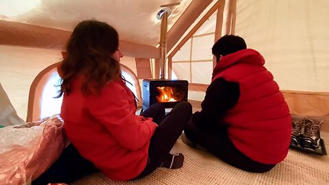 During heavy snowfall, we had a winter camp with our inflatable tent and a stove.