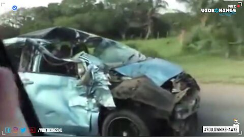 Dude pimpin' in his totally smashed up car.