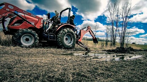 Powerful Backhoe Strapped Onto a 55hp Tractor!