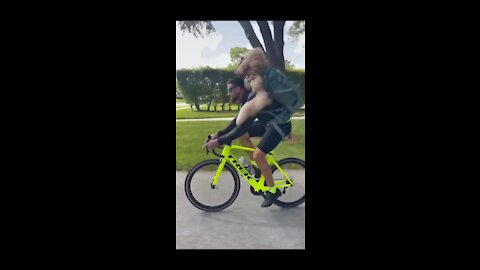 Funny video dog cycling with his friend