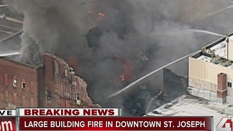 Crews work to put out building fire in St. Joseph