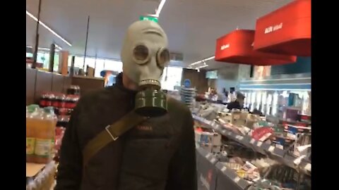 Wearing ghostly gasmask in German supermarket