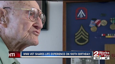 WWII vet shares life experiences on 100th birthday