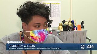 Educator works to boost students' self esteem through hair cuts