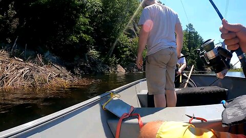 curious fisher man drops camera to see the fish he can't catch