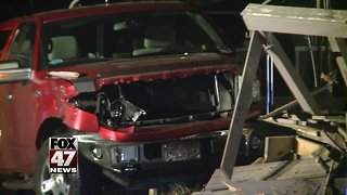 Man hurt after crashing truck into home