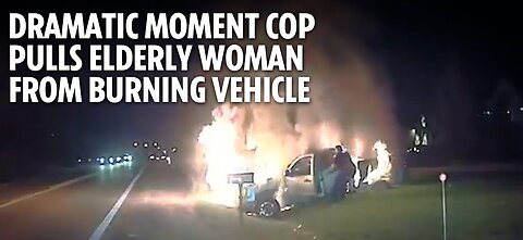 Dramatic moment cop pulls elderly woman from burning vehicle