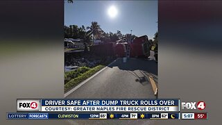 Driver safe after dump truck rolls over in Naples
