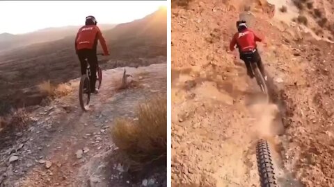 Men cycling on the rocky dangerous mountains