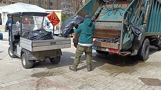 Parks and Recreation Department disposing trash down at the marathon Finish Line