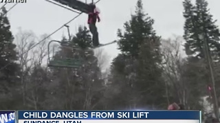 Child dangles from ski lift