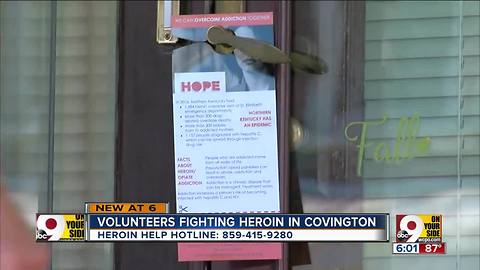 Volunteers go door to door distributing Northern Kentucky Addiction Helpline pamphlets