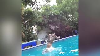 Boy Jumps In The Pool And Fails