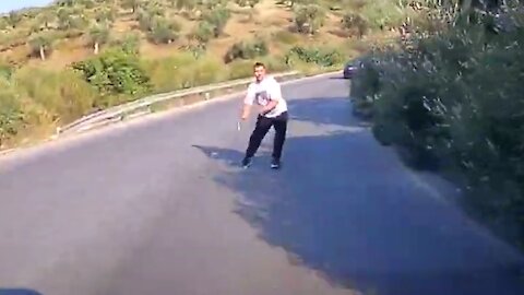 Crazy pedestrian jumping in front of a car. 2021.07.12 — NIKITI, GREECE