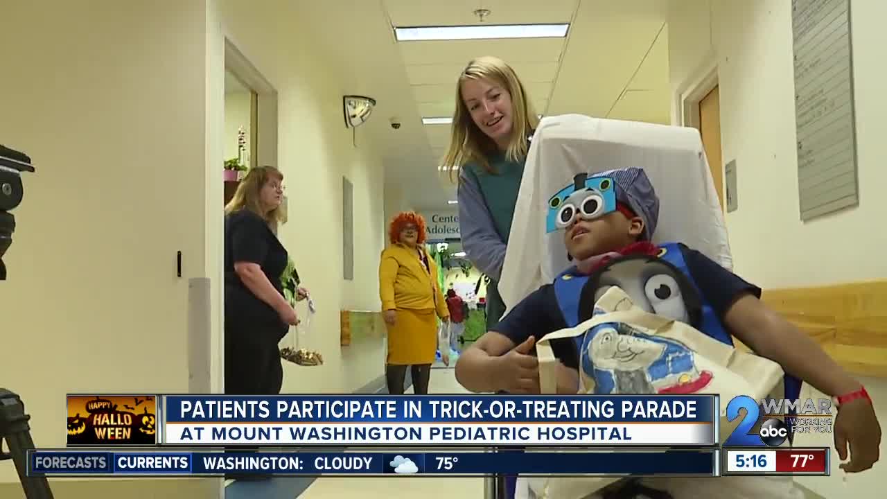 Patients participate in trick-or-treating parade in Mount Washington