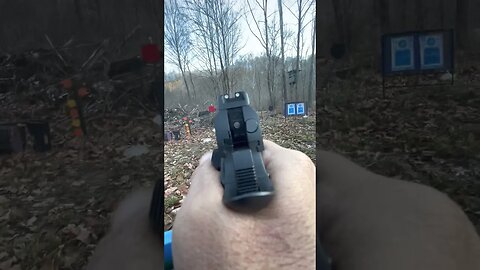 Using a camera to sight in a pistol.
