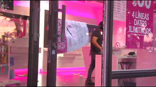 'It hurts,' T-Mobile store owner says after looters ransack business