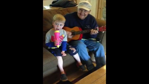 "Grandpa and Grandson Make Great Duet Together"
