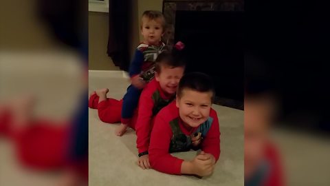 Little Boy Slaps His Brother In The Face While Posing For A Photo