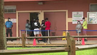 Soggy day at the polls as early voters cast ballots in Riviera Beach