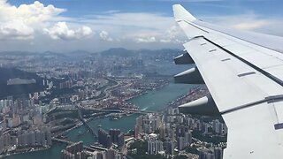 [City view] Cathay Pacific A330 approaching and landing into Hong Kong