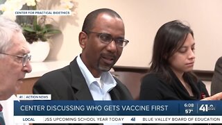 Center discussing who gets vaccine first