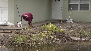 Residents cleaning up after flooding