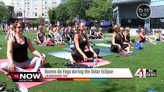 Dozens do yoga during solar eclipse