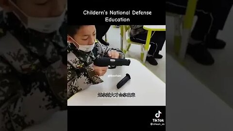 Chinese children assembling guns?