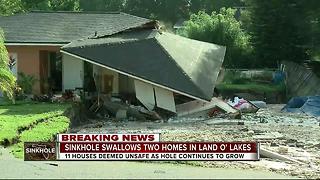 Sinkhole swallows two homes in Land O' Lakes