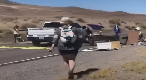 Nevada police car ploughing through Climate A's Blocking road😆😏🤡