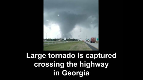 Large tornado is captured crossing the highway in Georgia
