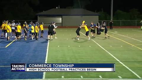 High school football season returns with midnight practice in Commerce Township