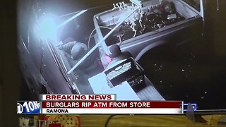 Search on for men who ripped ATM from Ramona store