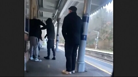 invaders attacking and robbing a British man at a train station