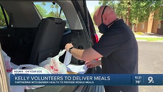 Senate candidate Mark Kelly volunteers with mobile meals to help those in need