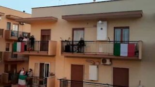 Quarantined residents Italian neighborhood jointly sing national anthem