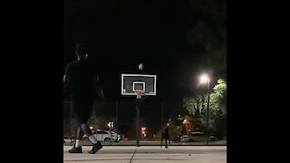 Guy plays 1-on-1 against dog, hits two incredible shots