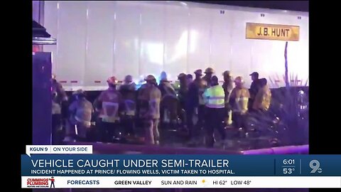 Crews rescue motorist trapped in car underneath semi-trailer